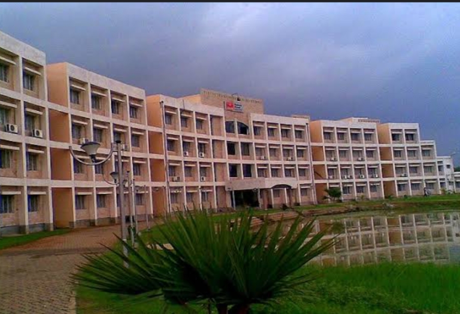 Main academic building of NSHM Knowledge Campus reflected in the campus pond